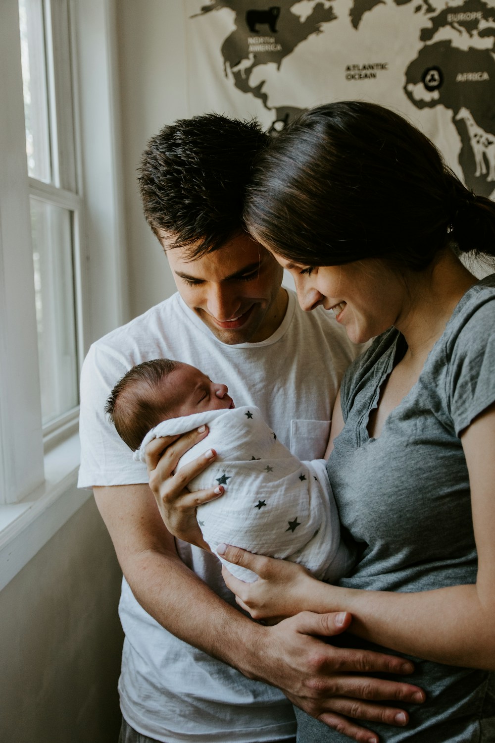 A couple holding their newborn